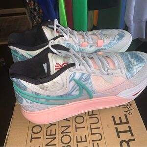 Nike Pink and Blue Athletic Shoes with Breathable Mesh and Supportive Overlays